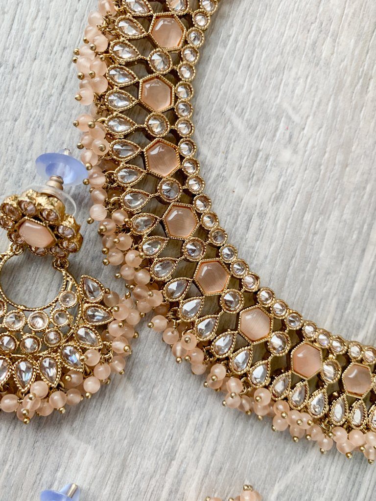 Reluctance in Light Peach Necklace Sets THE KUNDAN SHOP 