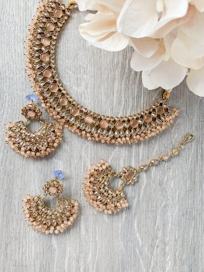 Reluctance in Light Peach Necklace Sets THE KUNDAN SHOP 