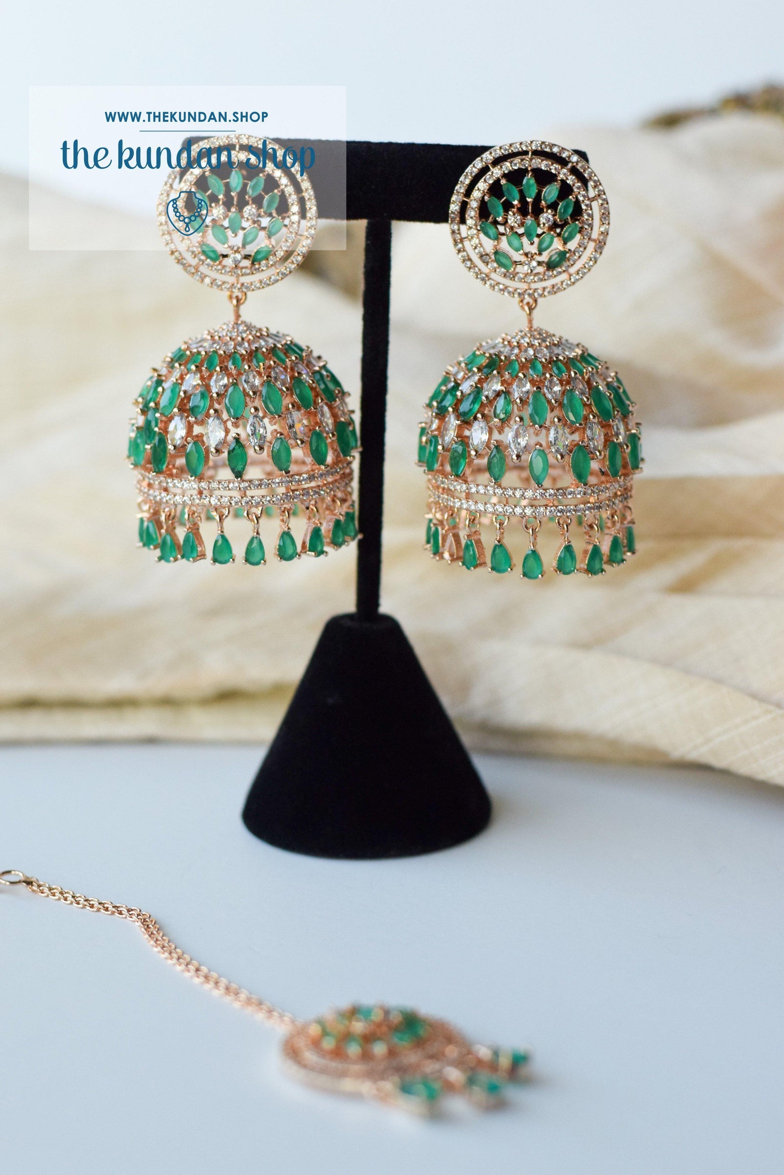 Allusive Jhumkis in Rose Gold & Emerald Earrings + Tikka THE KUNDAN SHOP 