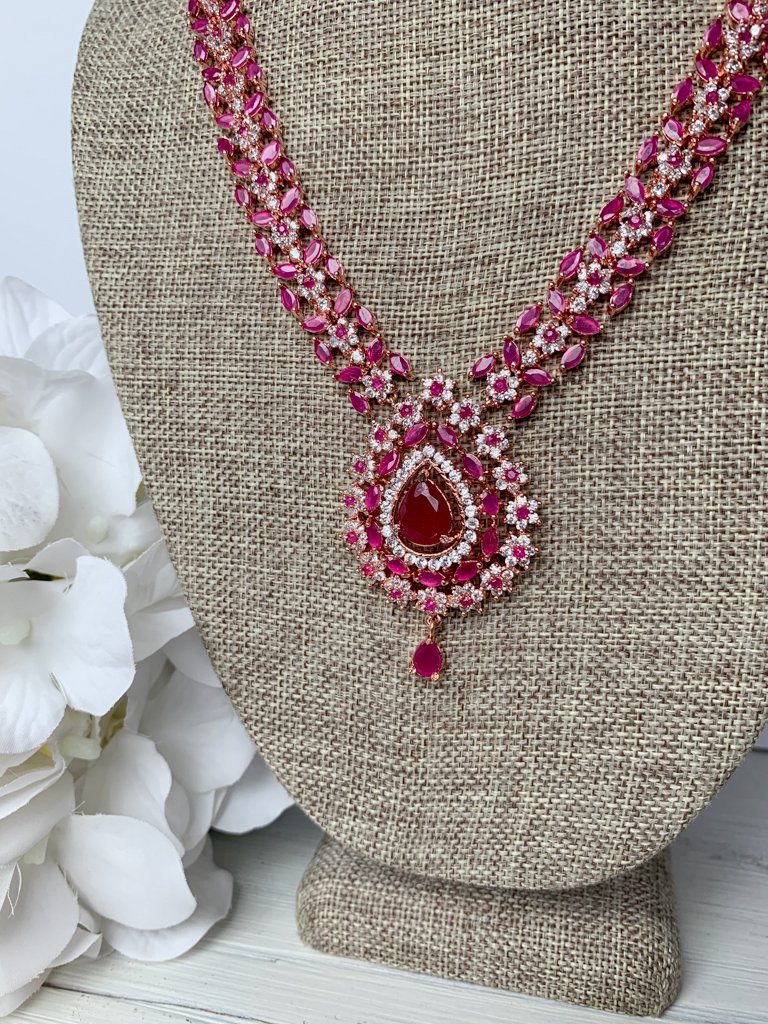 Favored Drops in Rose Gold & Ruby Necklace Sets THE KUNDAN SHOP 